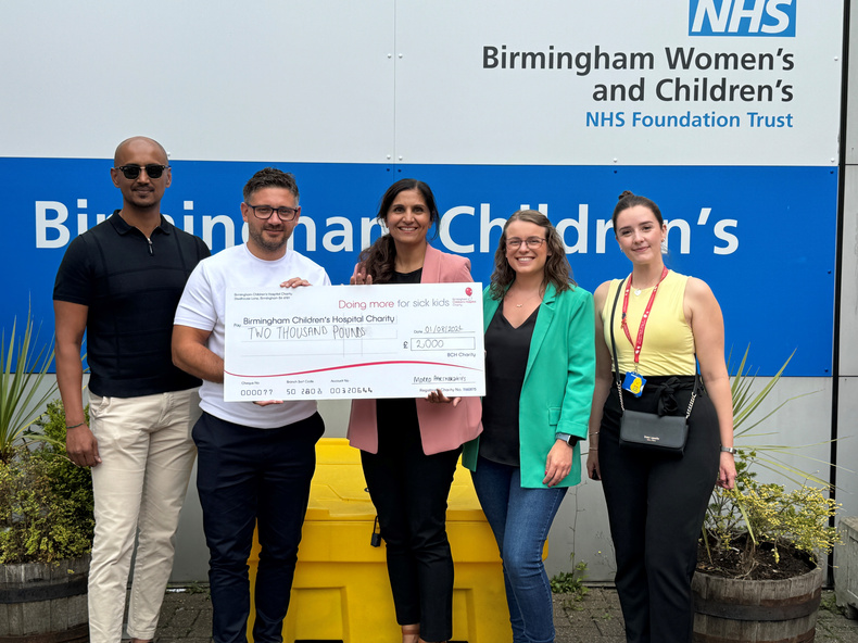 Representatives from Morro Partnerships present Birmingham Children's Hospital with a cheque for £2000.jpg