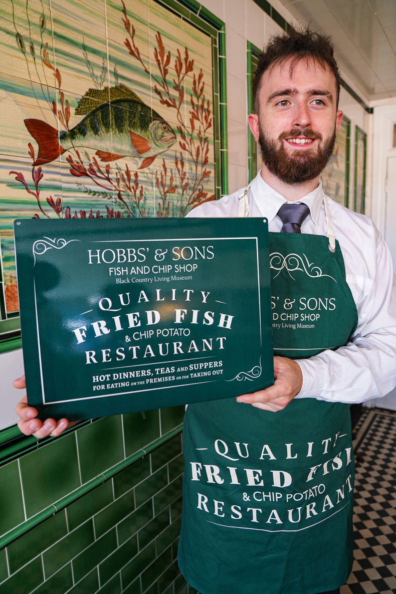 Museum colleague holding Hobbs merchandise.jpg