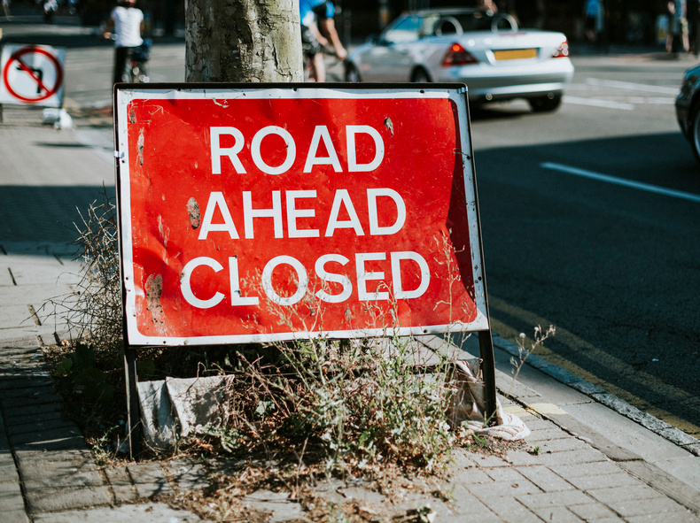 road-ahead-closed-sign-sidewalk.jpg