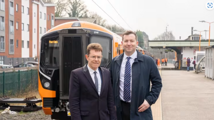 Mayor of the West Midlands Andy Street and West Midlands Railway managing director Ian McConnell with a Class 730 train at Four Oaks.png