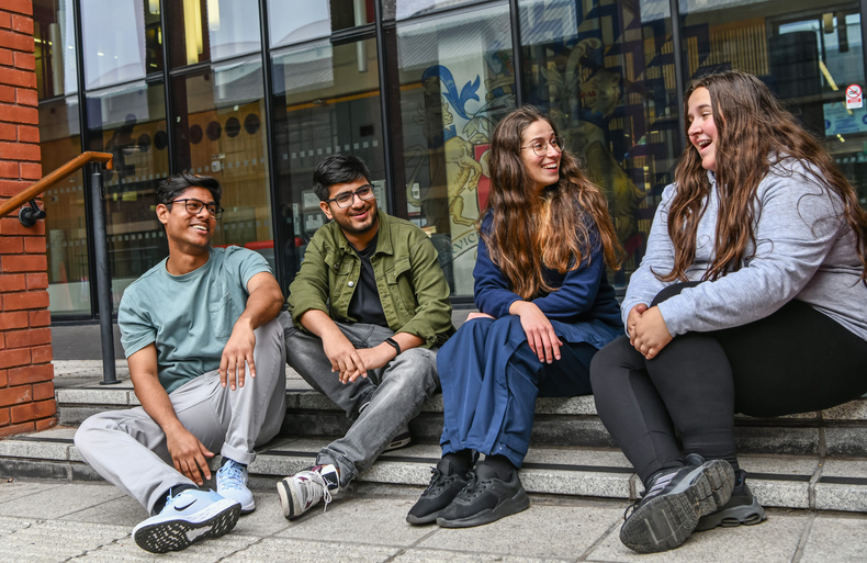 Students on Mac House steps.JPG