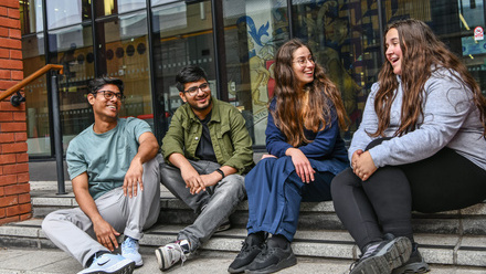Students on Mac House steps.JPG