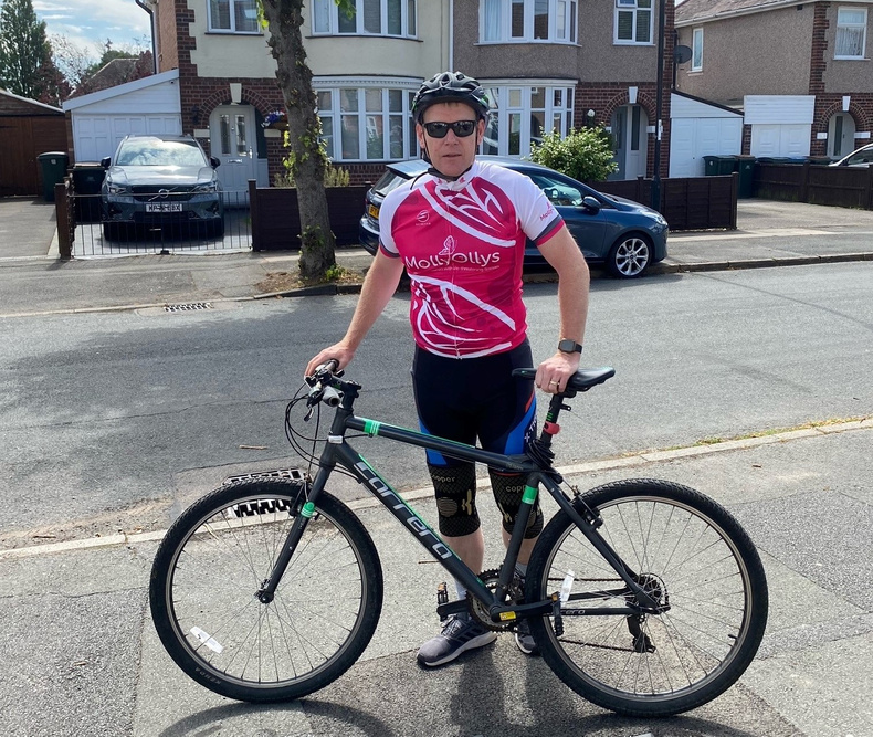 Spencer Costley taking a short break from the cycling.jpg