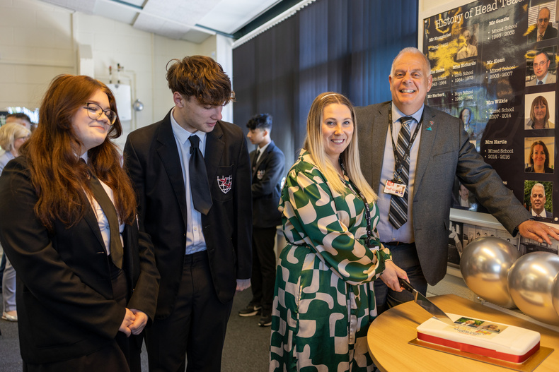 N Hagan and J Bridges cutting cake with learners.jpg