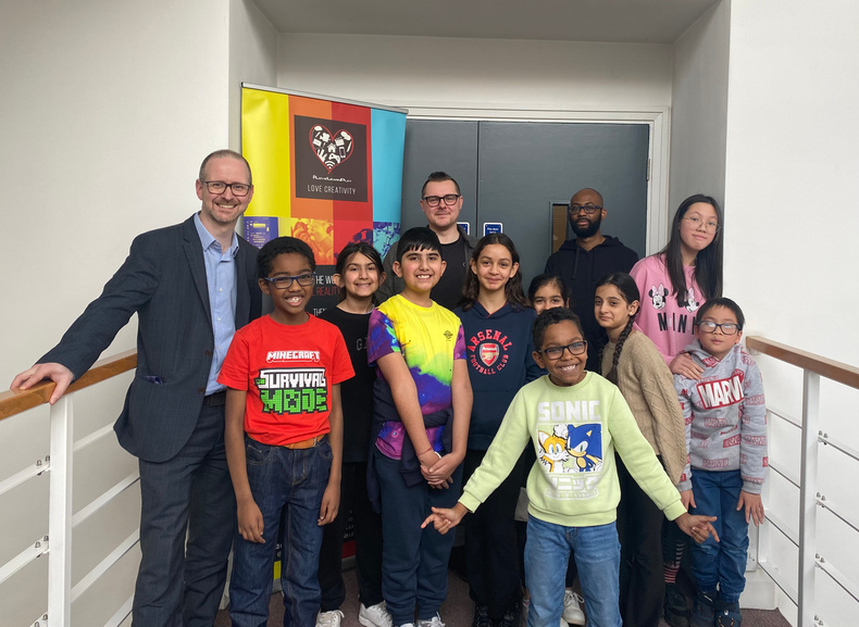 Neil Johnston, Simon Gull and Justin Rutherford with children at LearnPlay Foundation.jpg